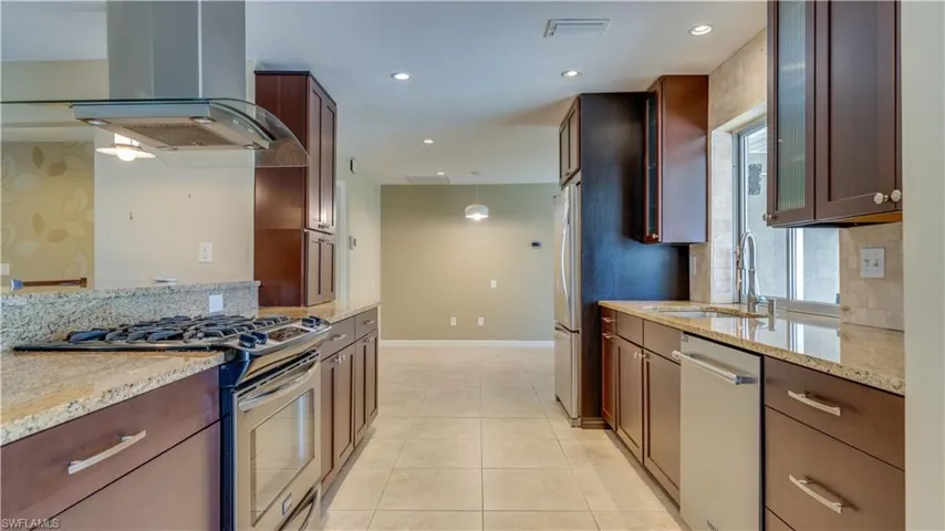 Kitchen with stainless steel appliances, granite countertops
