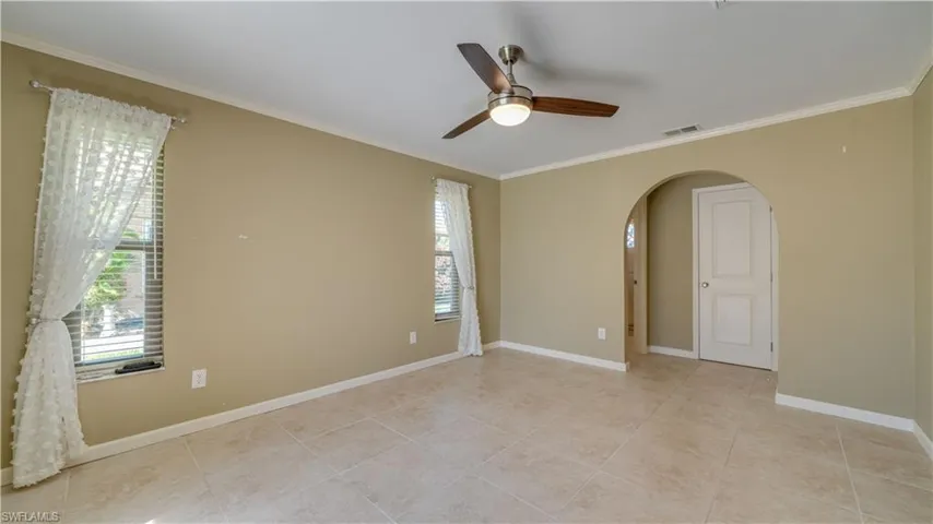 Primary bedroom with tiled floors