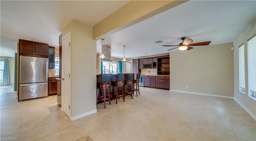 Kitchen featuring stainless steel fridge, kitchen breakfast bar