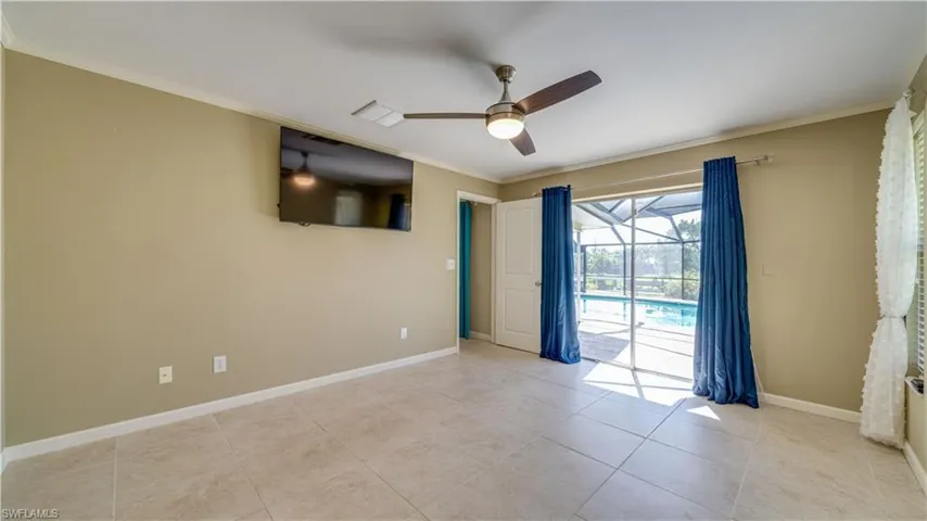 Primary Bedroom, tile flooring, and crown molding