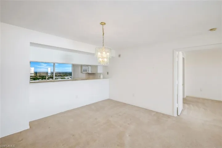 Empty room with light colored carpet