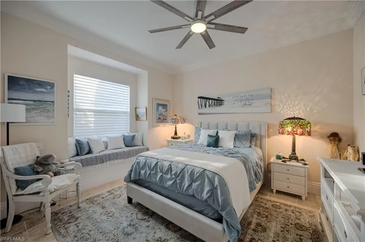 Bedroom with crown molding and ceiling fan