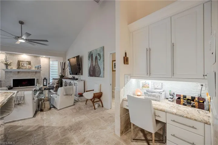 built-in desk by kitchen area