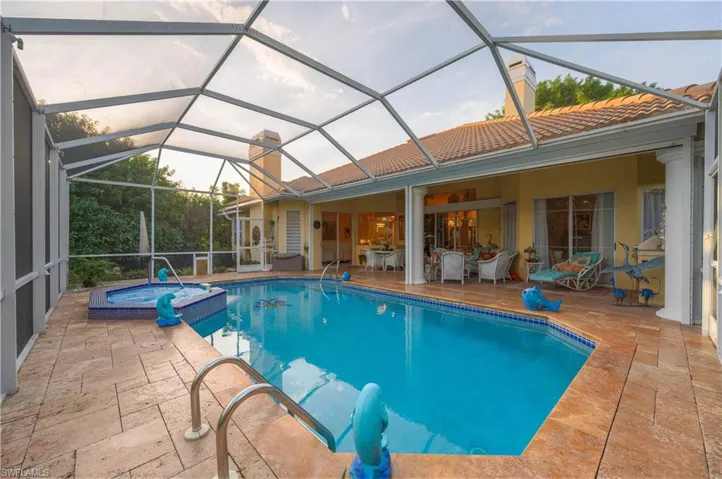 View of pool featuring an in ground hot tub, a lanai, and a patio area