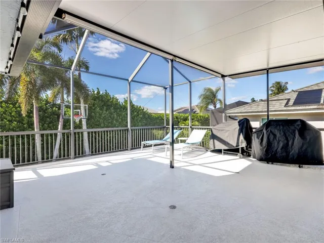 Sunroom / solarium featuring a patio
