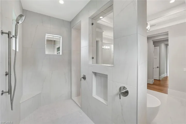 Bathroom featuring a walk in shower and recessed lighting