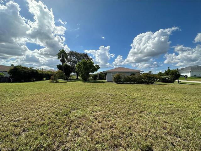 Standing on the lot facing West towards neighbors Single Family Home