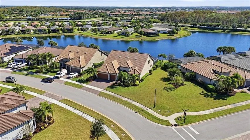 Aerial view of residential area with a large body of water