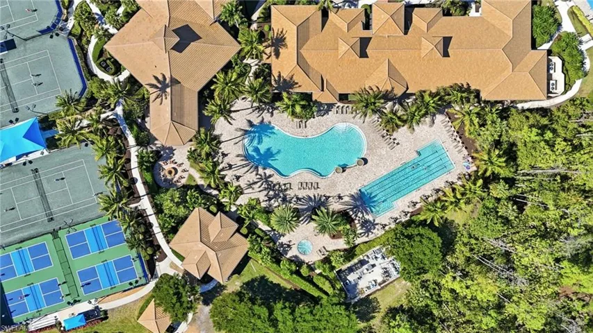 Drone / aerial view of the clubhouse and pool