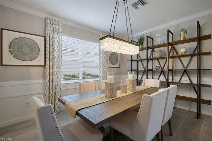 Dining space with crown molding