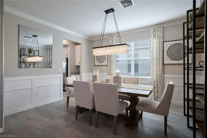 Dining area with crown molding