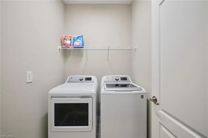 Laundry area featuring independent washer and dryer