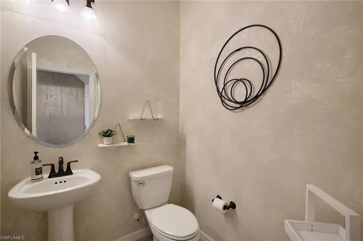 Bathroom with sink and toilet