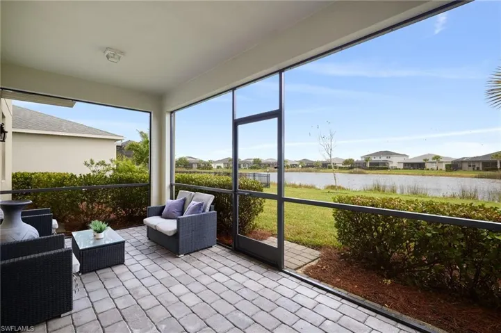 Sunroom / solarium with a water view