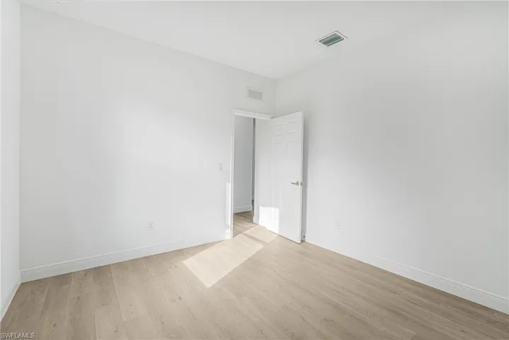 Spare room with light hardwood / wood-style floors