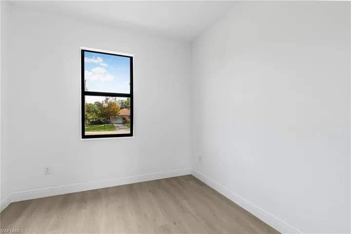Unfurnished room featuring light wood-type flooring