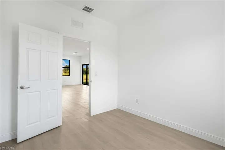 Spare room with light wood-type flooring