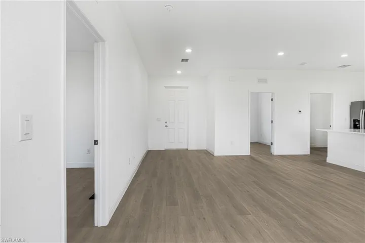 Empty room featuring wood-type flooring