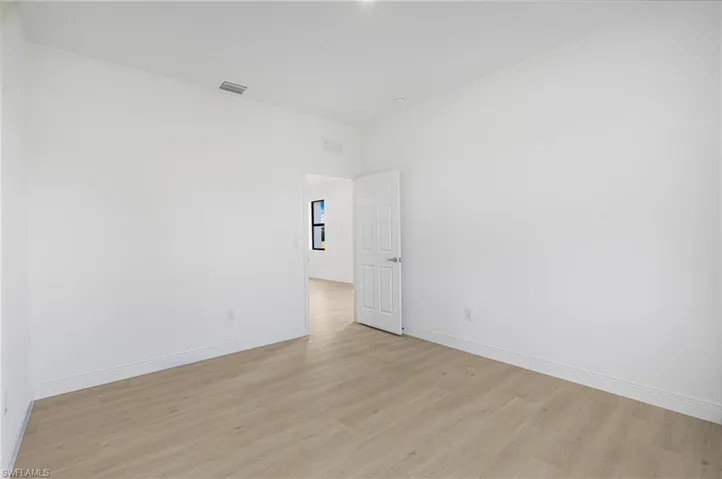Spare room with light hardwood / wood-style flooring