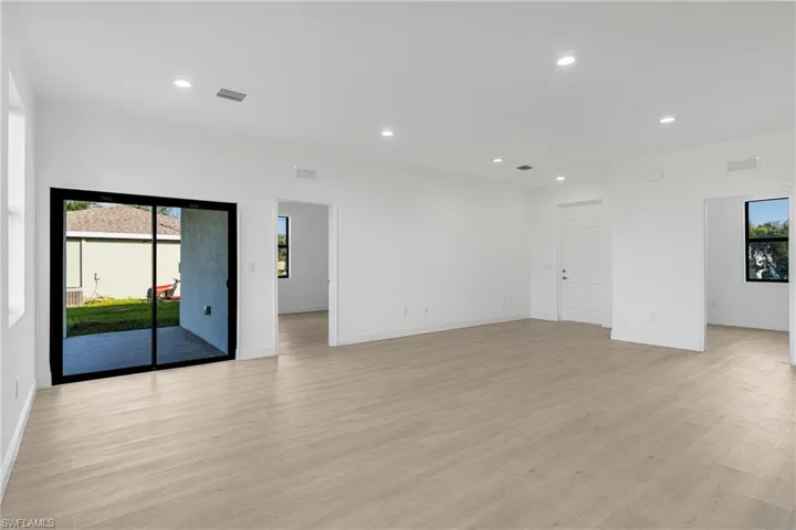 Spare room featuring light wood-type flooring