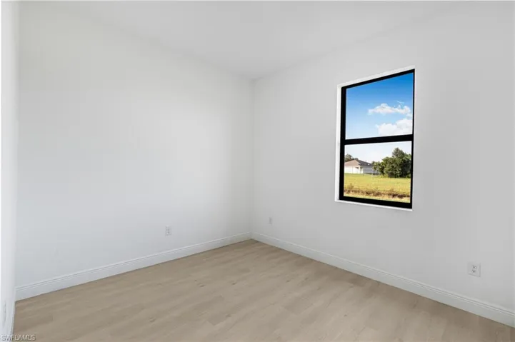 Spare room featuring light wood-type flooring