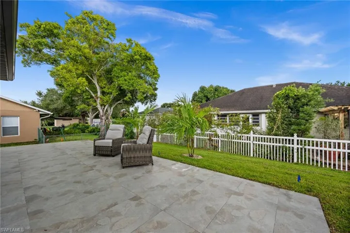 Expansive outdoor patio featuring large format tile flooring