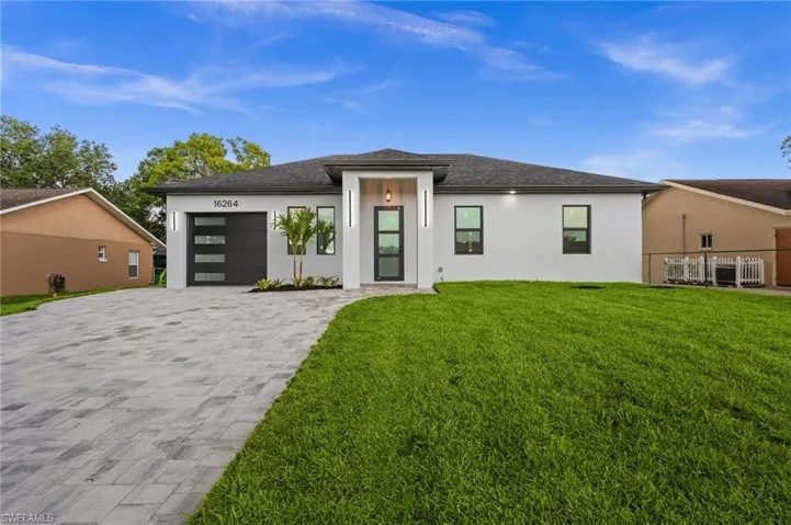 Contemporary single-story residence with a crisp white exterior