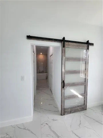 Corridor with a barn door