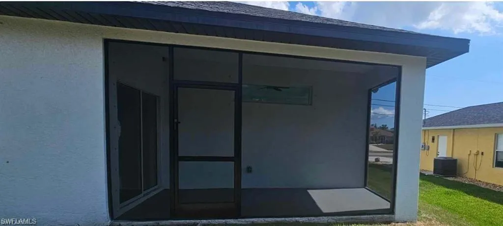 Property entrance featuring central AC