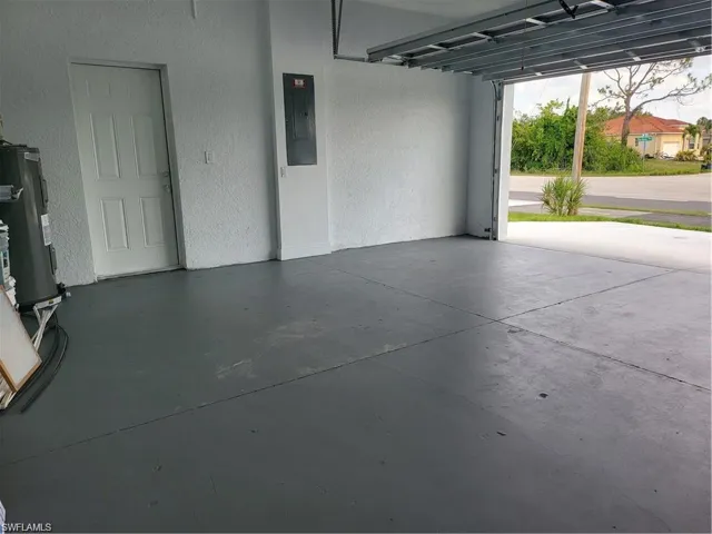 Garage with electric panel and electric water heater
