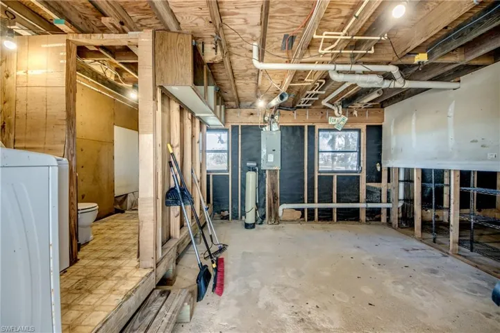 Basement featuring washer / dryer and electric panel