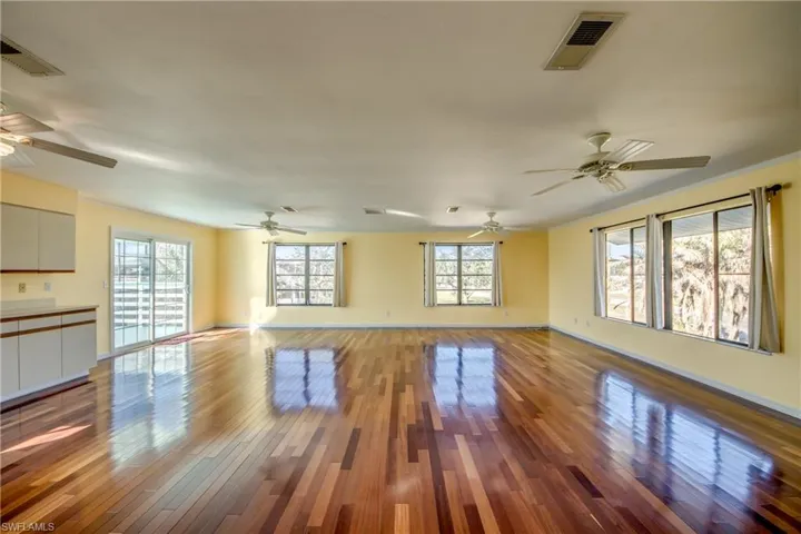 Unfurnished living room with wood-type flooring