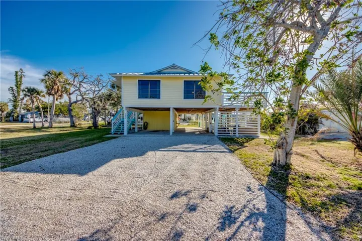 Raised beach house with a carport
