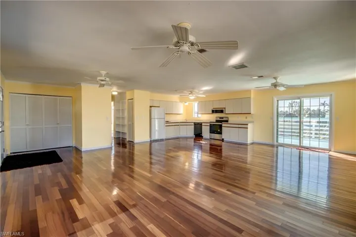 Unfurnished living room with hardwood / wood-style flooring