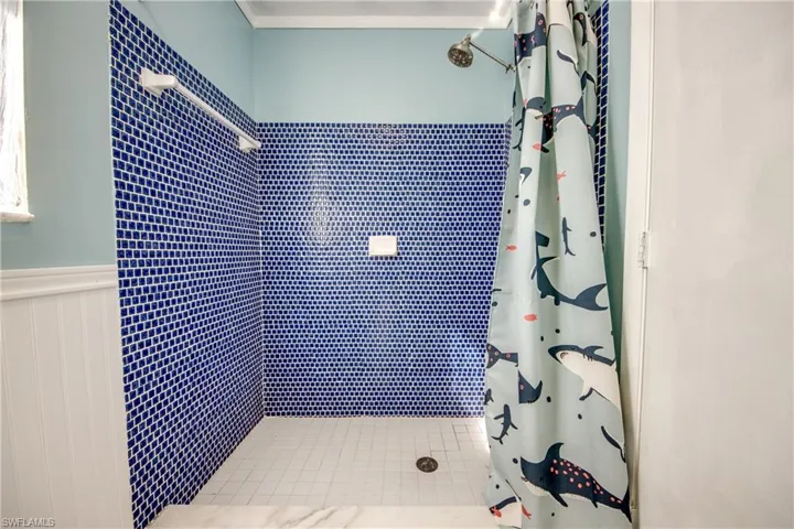 Bathroom with curtained shower