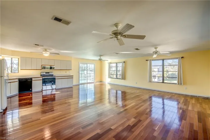 Unfurnished living room with light hardwood / wood-style floors