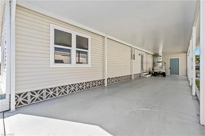 View of patio featuring a carport
