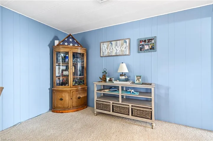 Detailed view of carpet floors and wooden walls