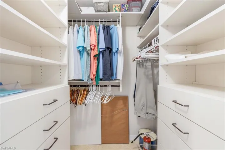 Spacious closet featuring light tile patterned floors