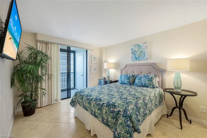 Bedroom featuring access to exterior and light tile patterned flooring