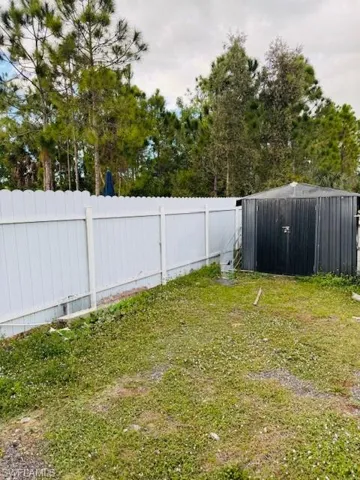 View of yard with storage shed