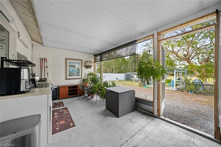 Sunroom / solarium featuring exterior kitchen