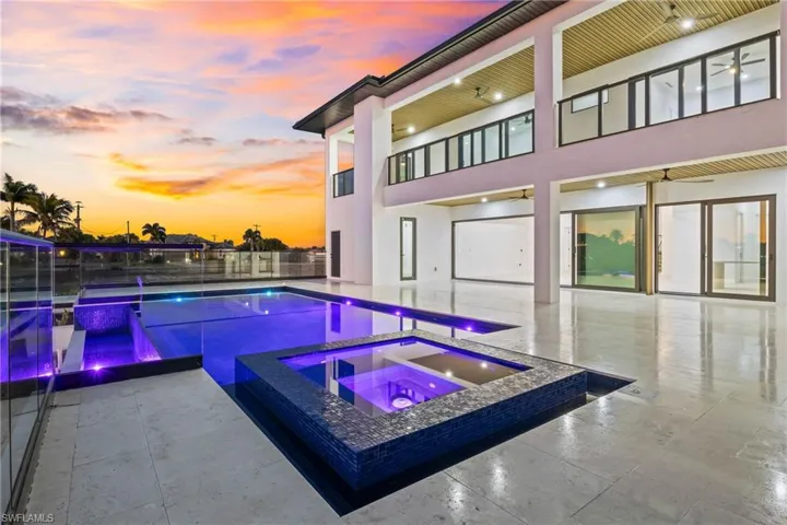 Integrated pool / spa with a patio and a balcony