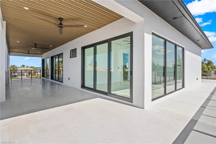 View of patio featuring ceiling fan