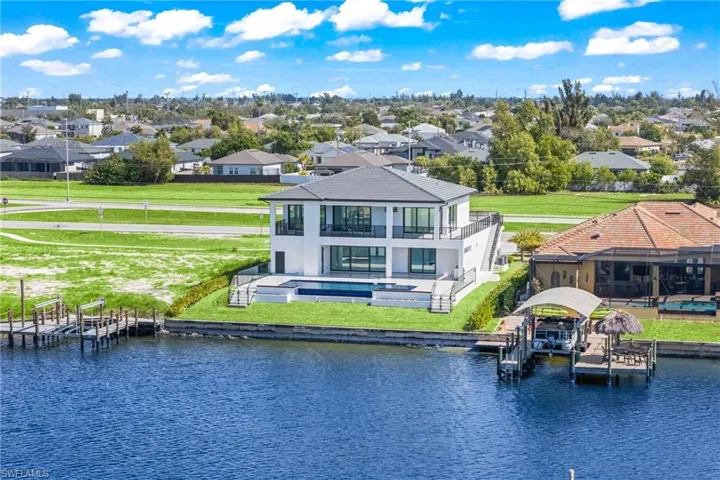Aerial perspective of suburban area with a large body of water