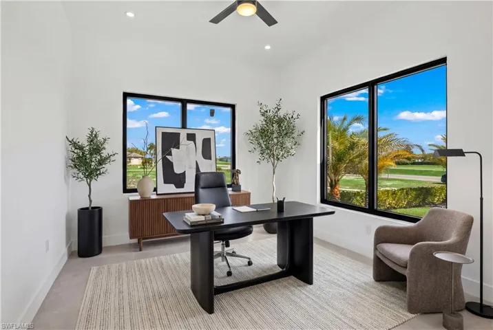 Office area with ceiling fan, finished concrete flooring, and recessed lighting