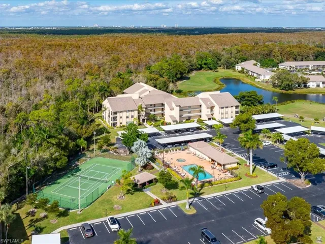 Bird's eye view of a golf course and a large body of water