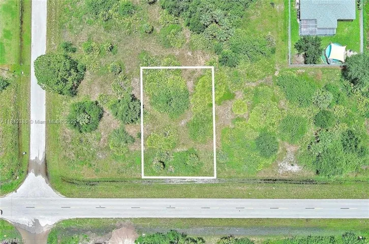 Aerial overview of property's location with property parcel outlined