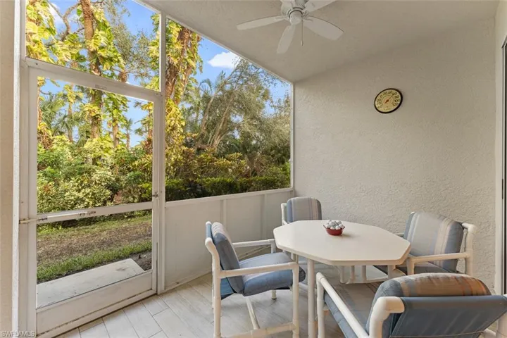 Screened in patio allows for clear, unobstructed views of well-maintained landscaping. Patio tiles replaced 2019.