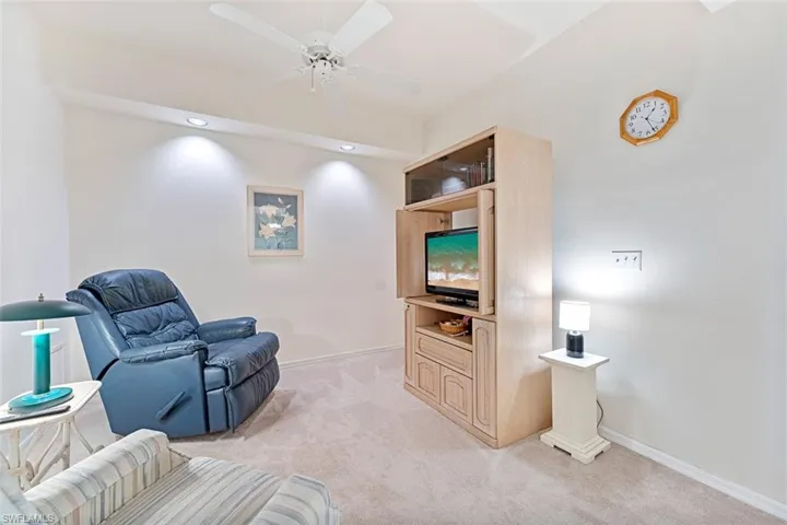 Den being used as movie room. Overhead lights allow plenty of light.